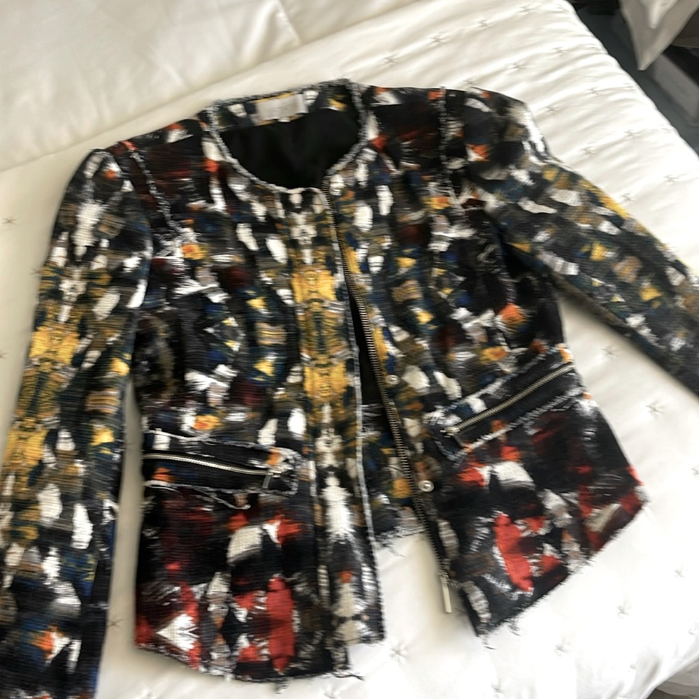 Very fitted multi colored jacket great to wear with jeans or black pants.